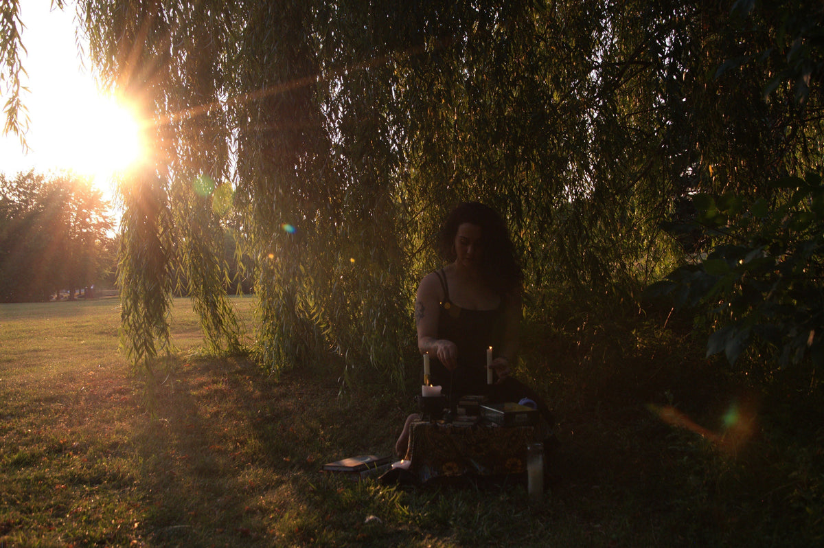 Woman resting with a cup of tea in soft morning light